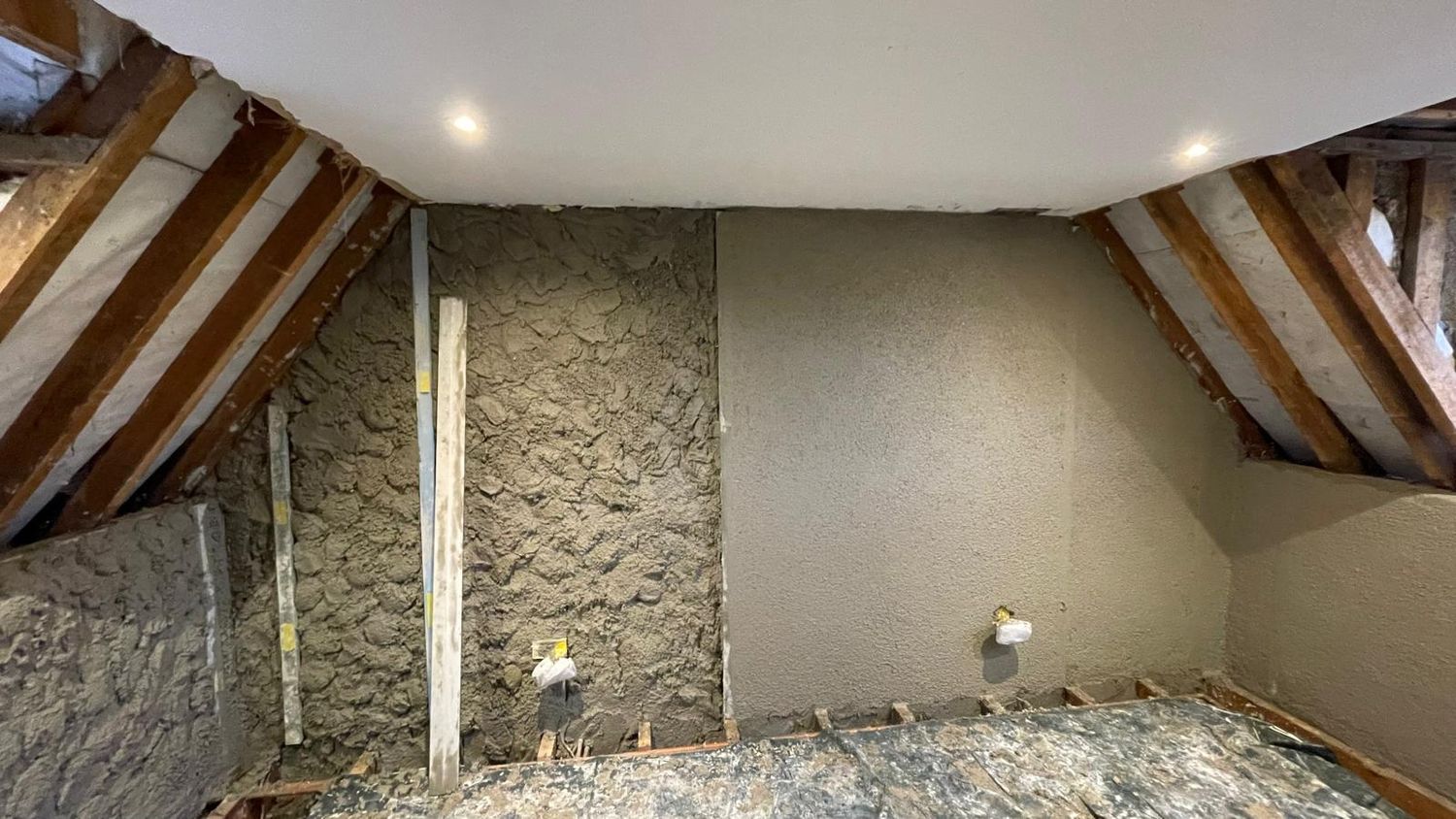 Diathonite in a loft room, the walls coated and the roof slope lined