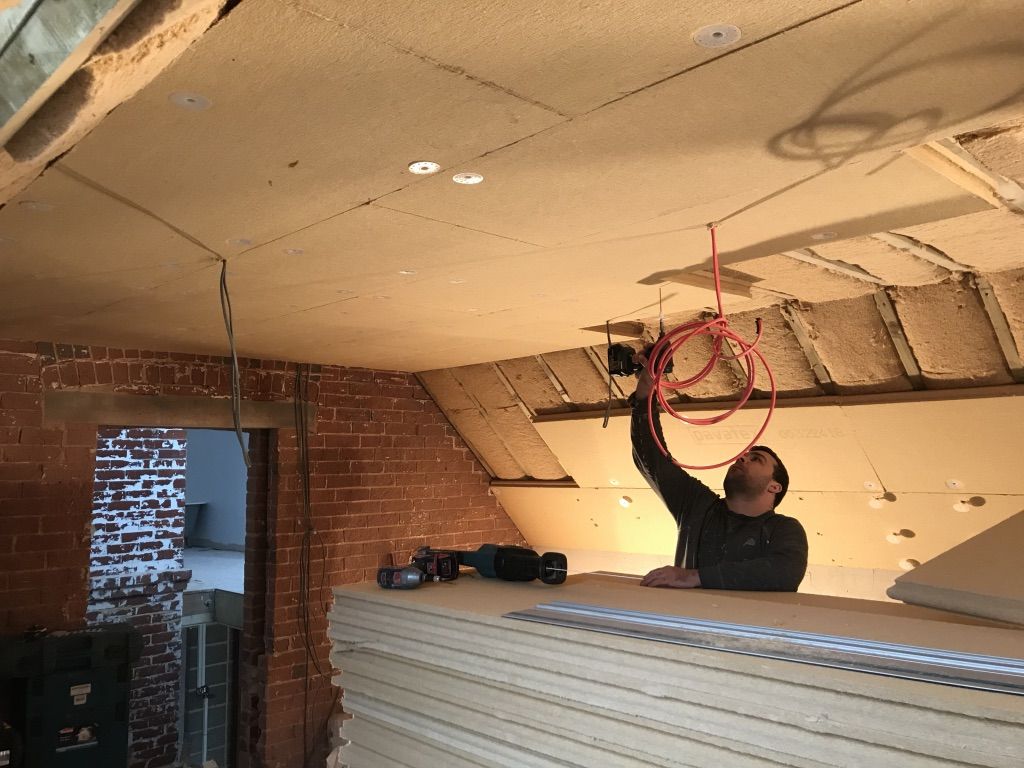 Insulation boards going up on a roof slope