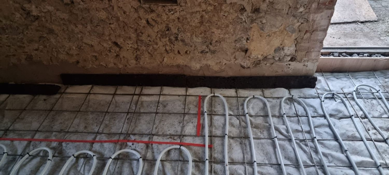 Installing cork insulation strip at the perimeters