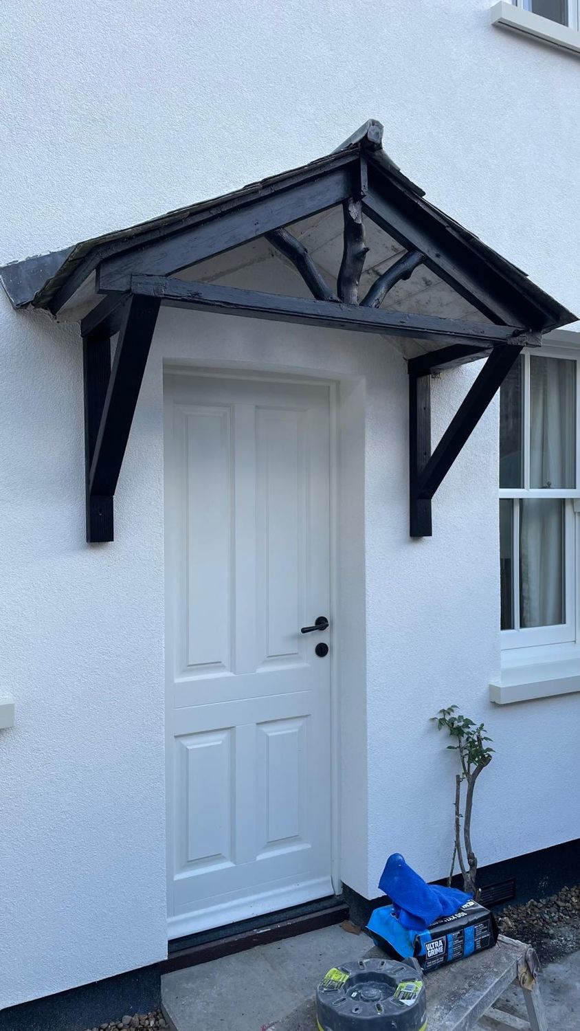 Decorative timber for side entrance porch roof reinstalled