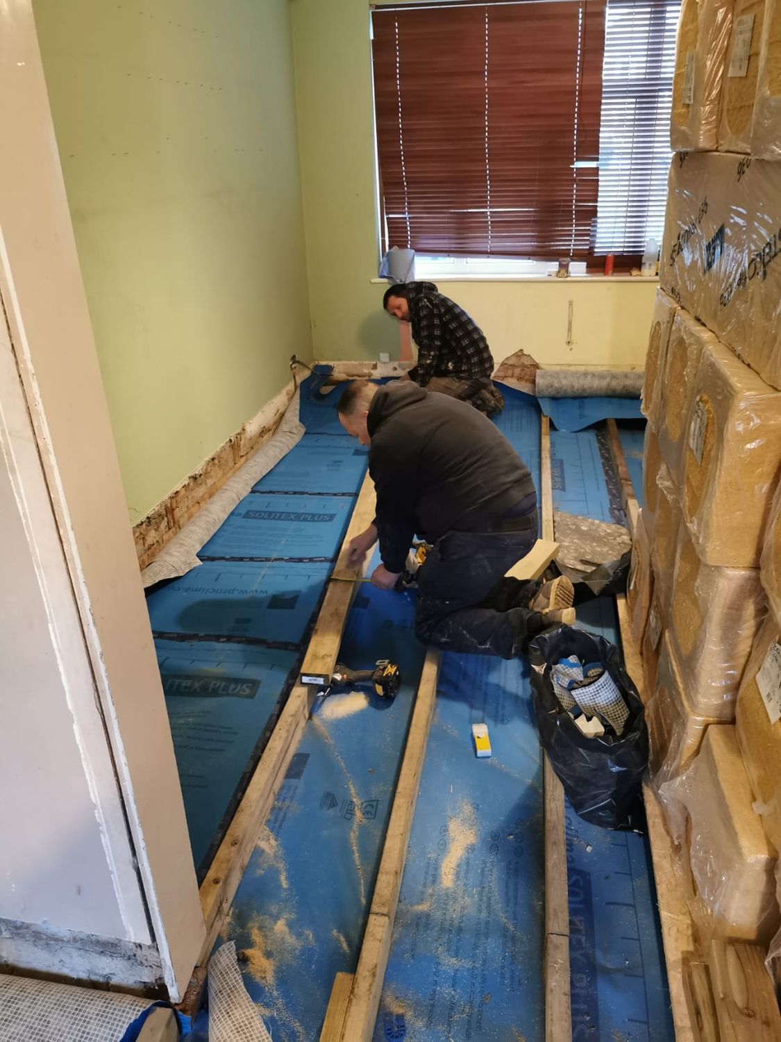 Installation of ProClima Solitex Plus breathable membrane before existing floor insulation