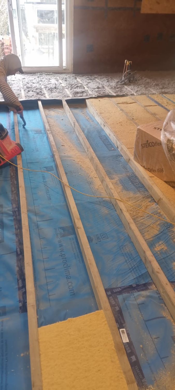 Installation of Steico Flex wood fibre batts to existing floor in Finchley