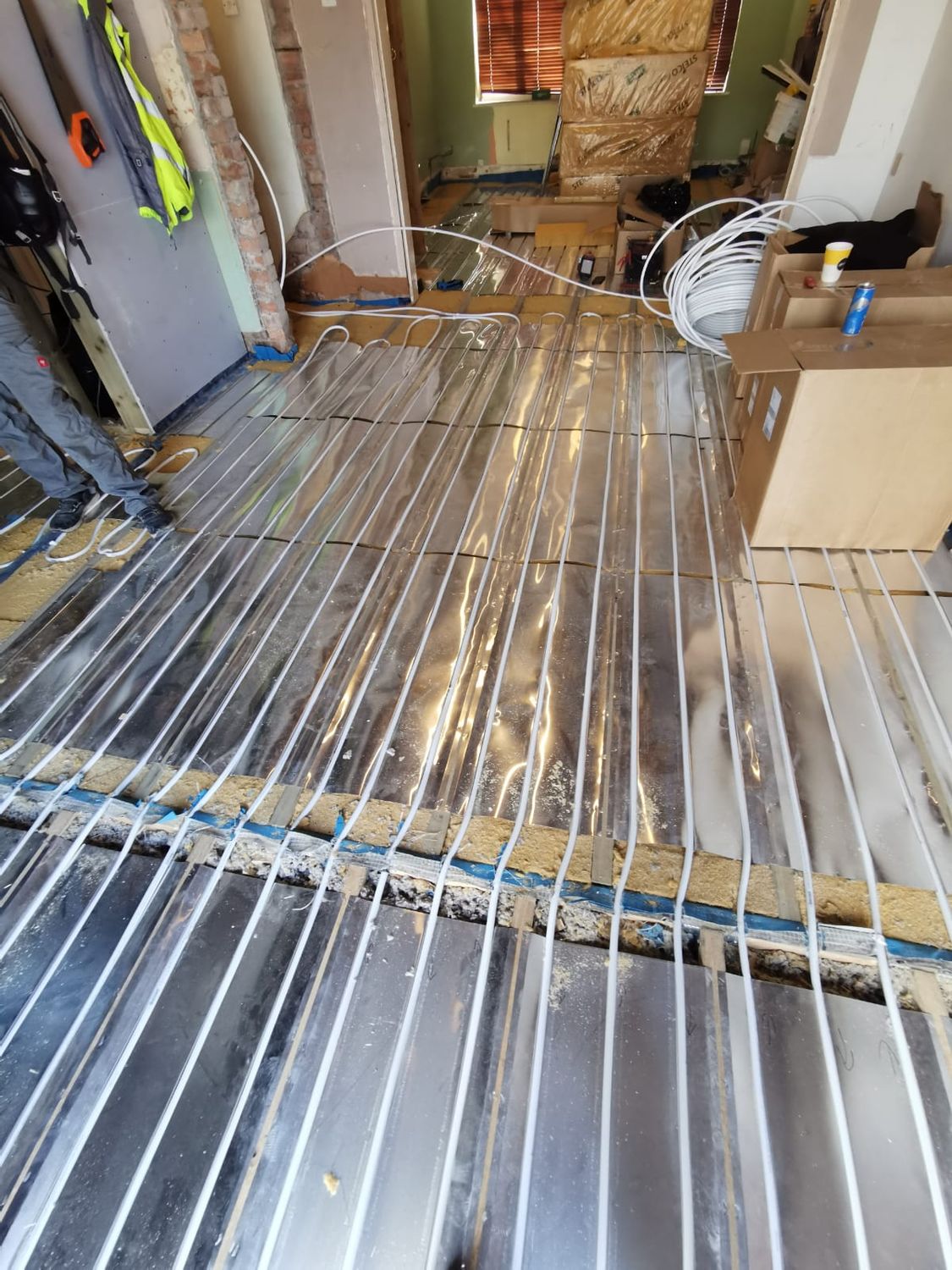 Underfloor heating installed with aluminium spreader plates