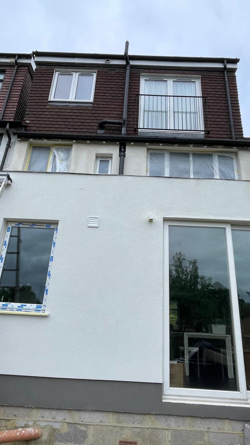 Breathable silicone render finish and mosaic render on plinth insulation