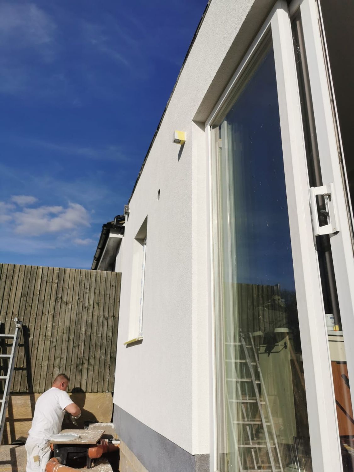 Plinth insulation render being applied