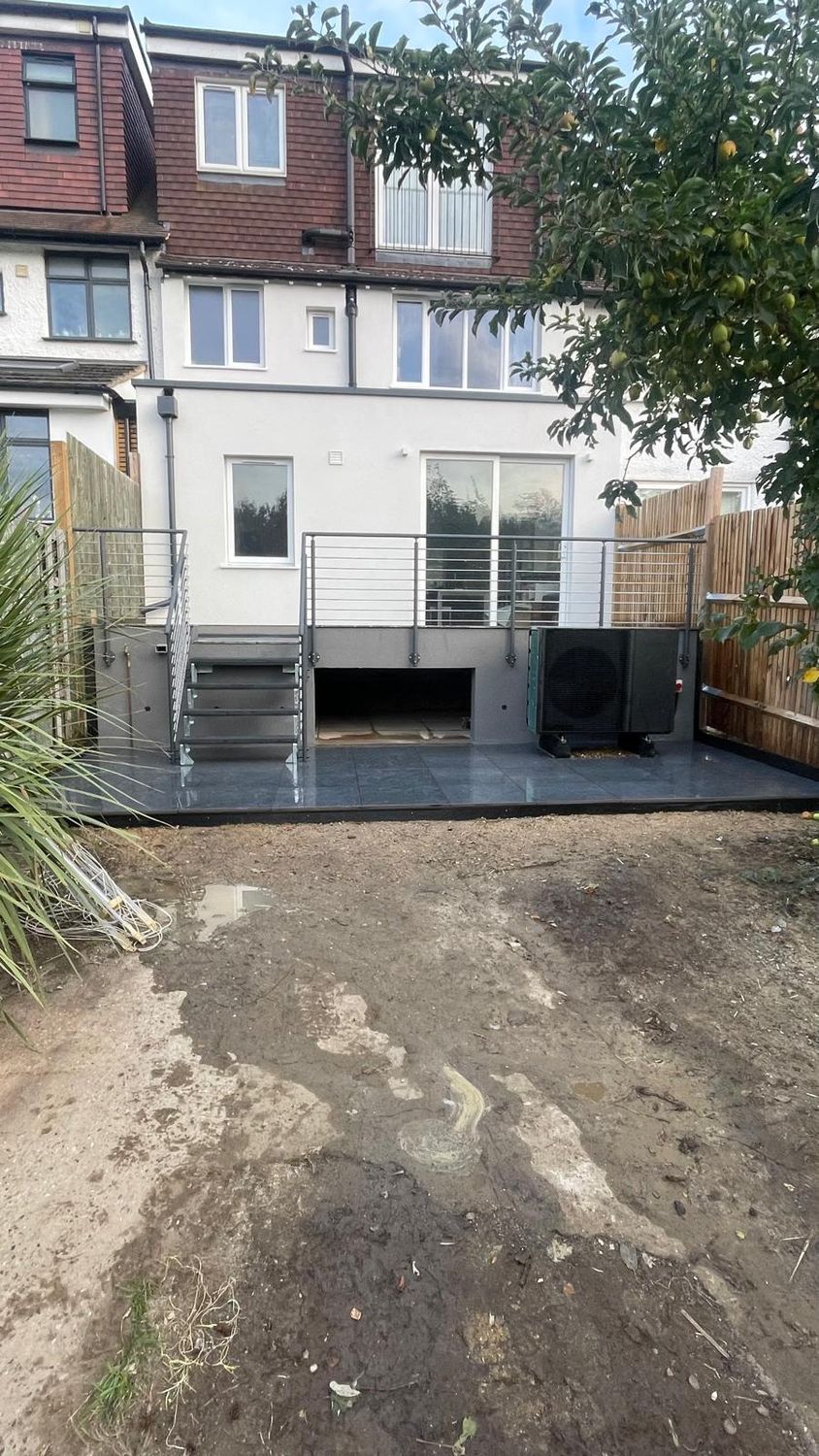 Paving and heat pump in rear garden