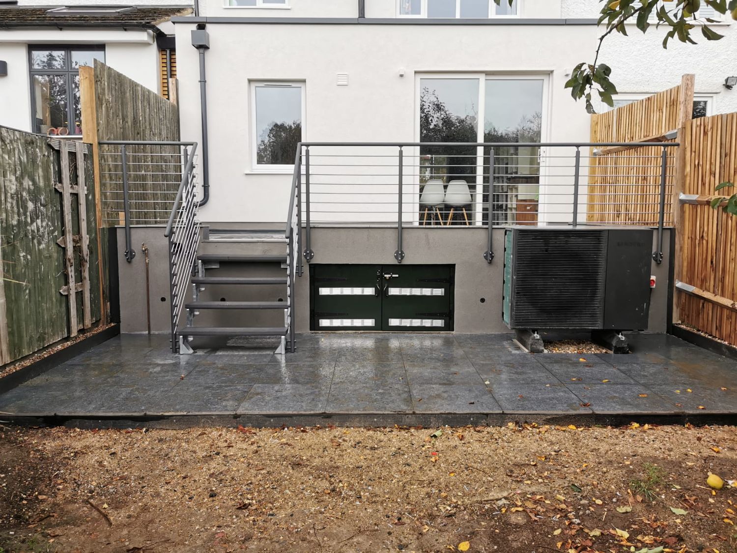 Rear extension completed with heat pump and patio in Finchley