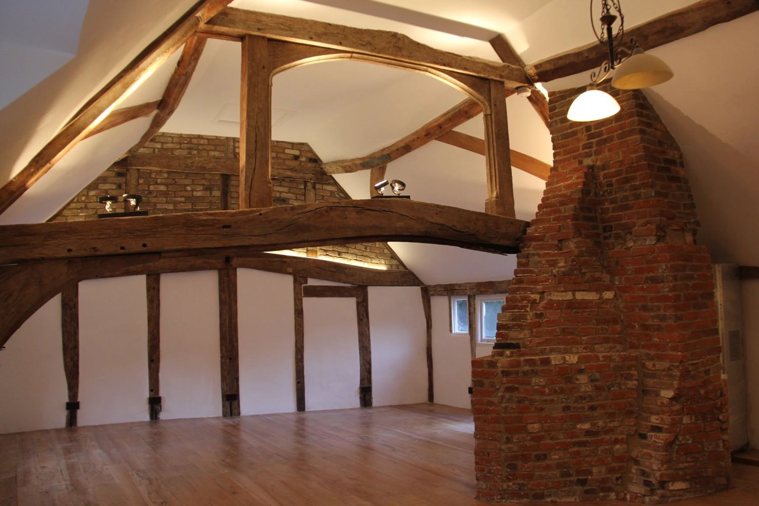 Fully insulated and refurbished living room with exposed oak structure, lighting has been installed