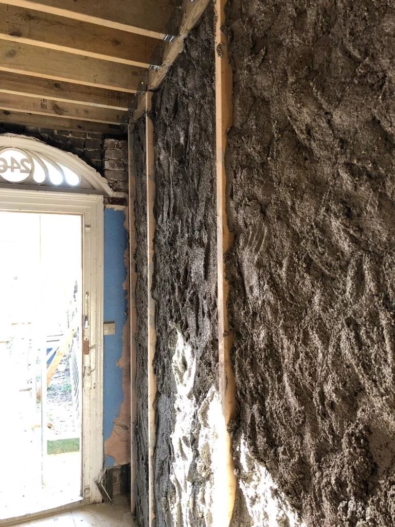 Diathonite Evolution lime-cork-clay plaster being applied to wall