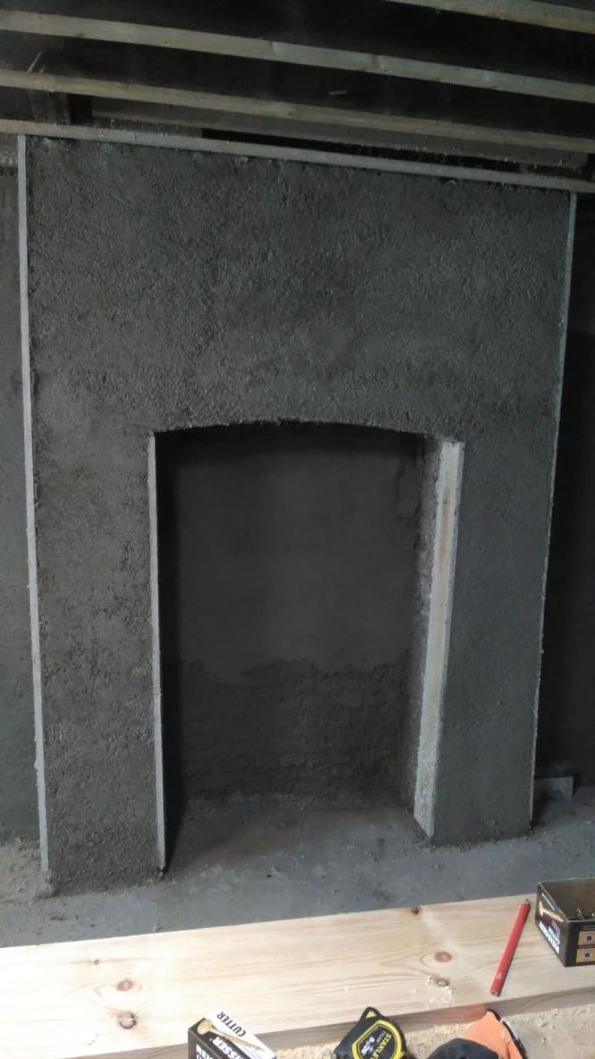 Diathonite Evolution lime-cork-clay plaster applied to fireplace