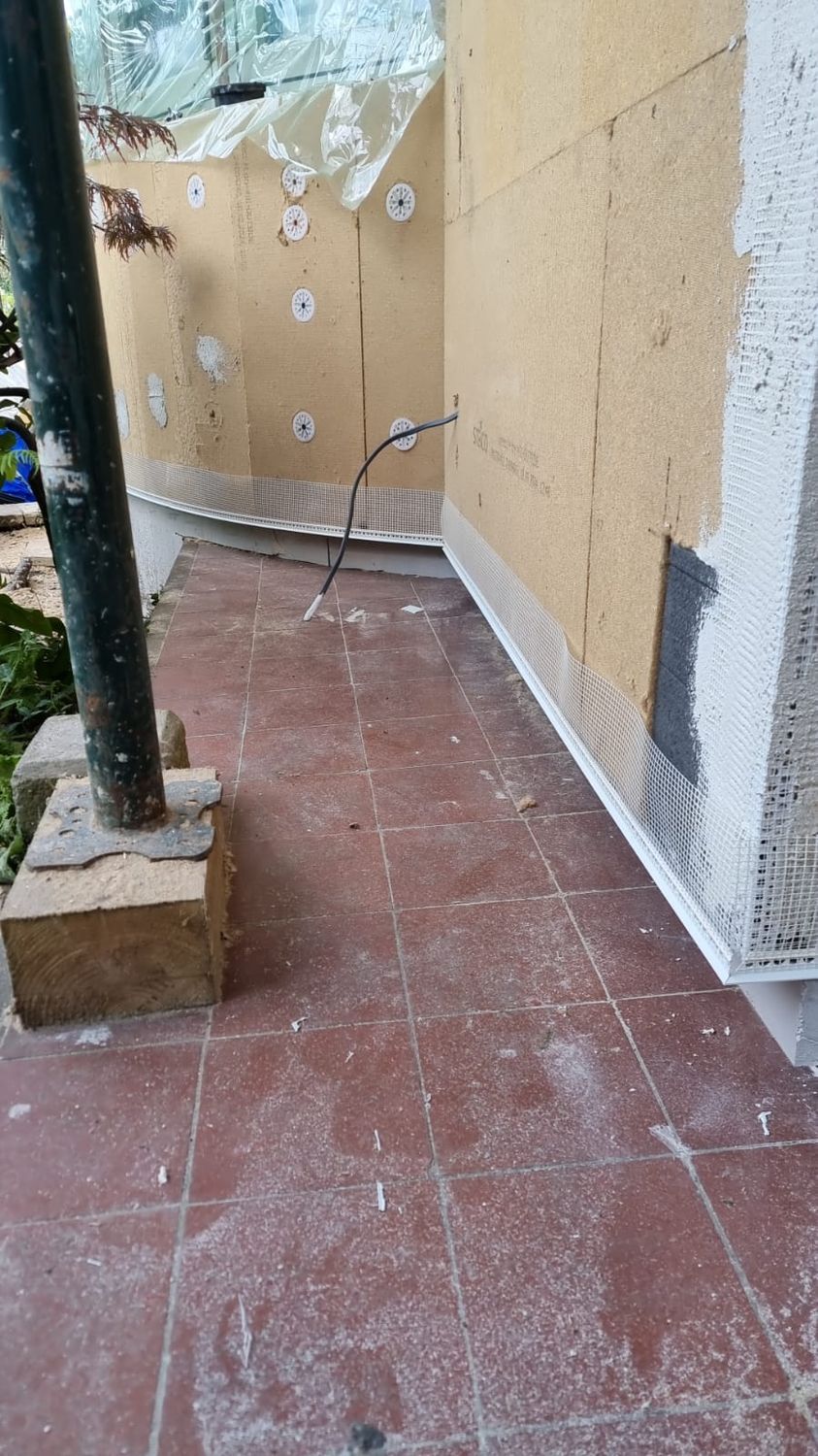 Installation of Steico wood fibre boards on bay wall