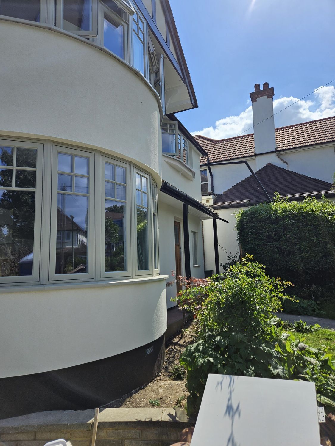External wall insulation with wood fibre boards and breathable silicone render finish - front bay window