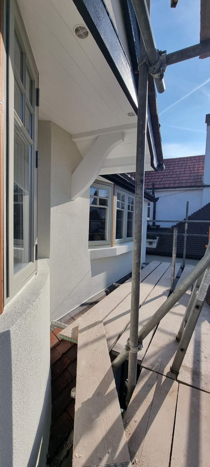 External wall insulation completed and timber features repainted for upper front bay windows and eaves