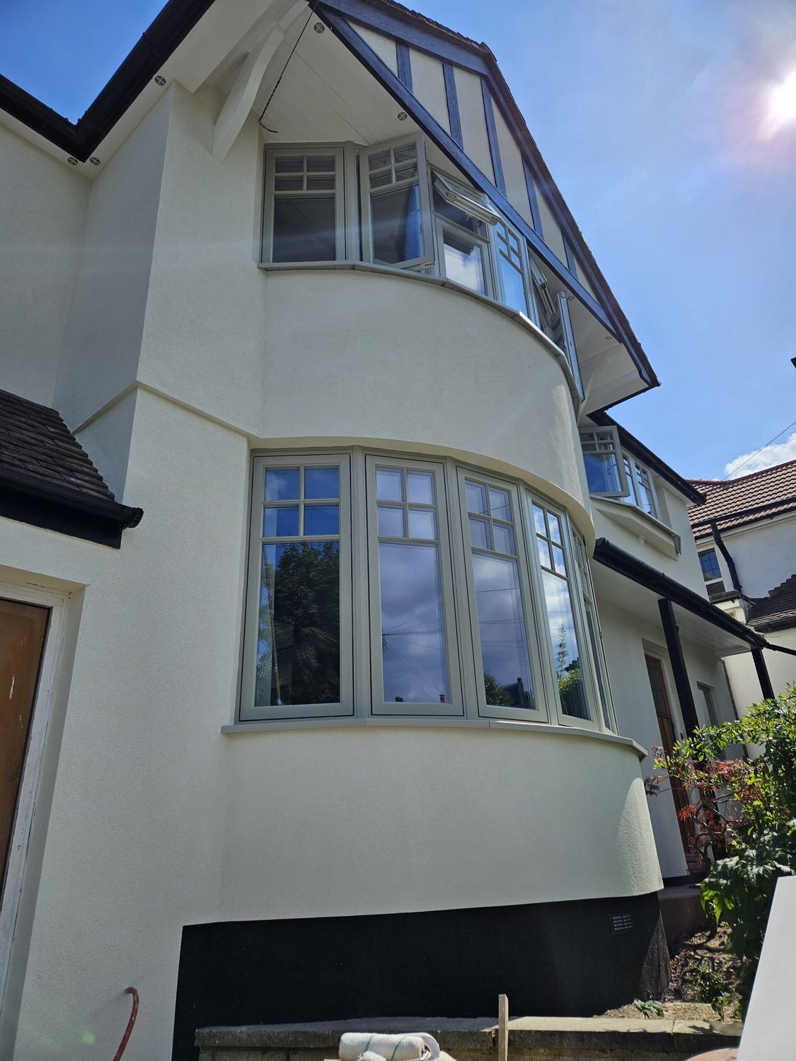 External wall insulation with wood fibre boards and breathable silicone render finish - front bay window
