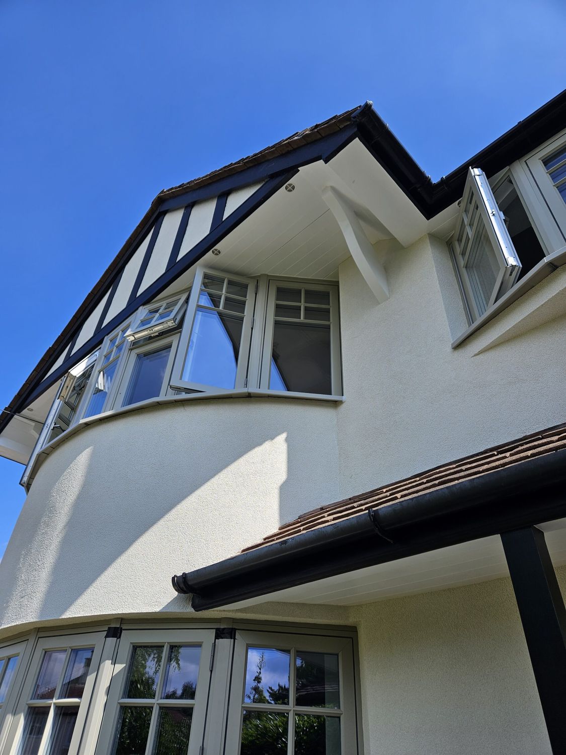 External wall insulation with wood fibre boards and breathable silicone render finish - front bay window