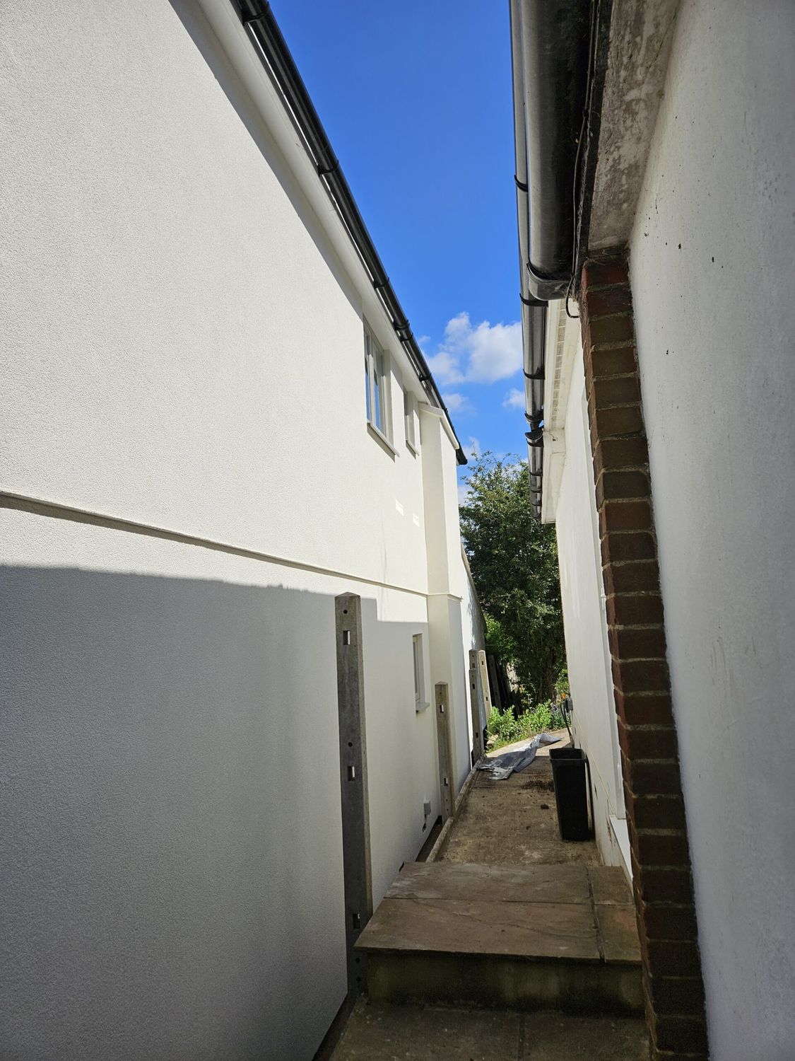 External wall insulation with wood fibre boards and breathable silicone render finish - completed on side elevation