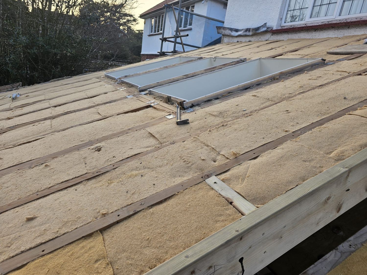 Roof insulation with Gutex thermoflex wood fibre insulation batts from above