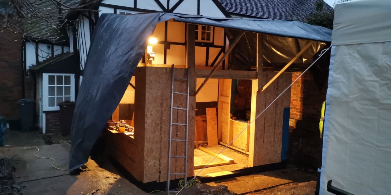 Timber frame wall structure being installed