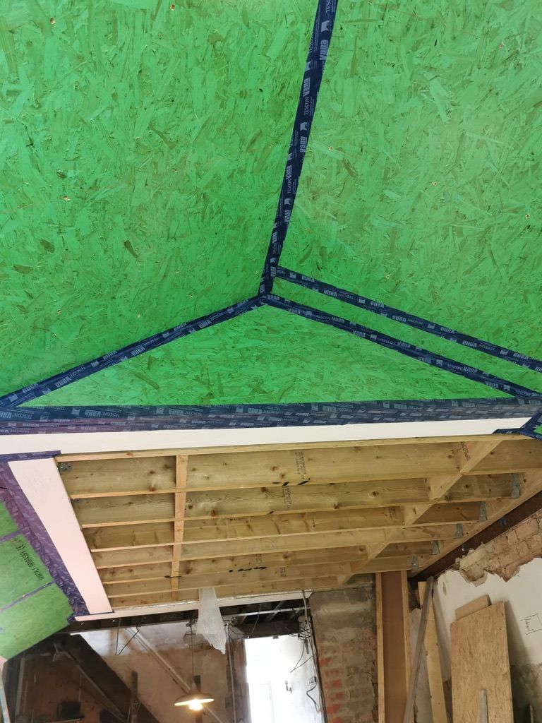 Rear extension roof boarded with Finsa airtight vapour barrier boards & airtight taped at junctions
