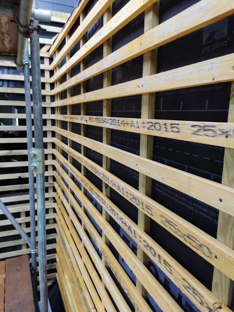 Battening installed for cladding over external wall insulation