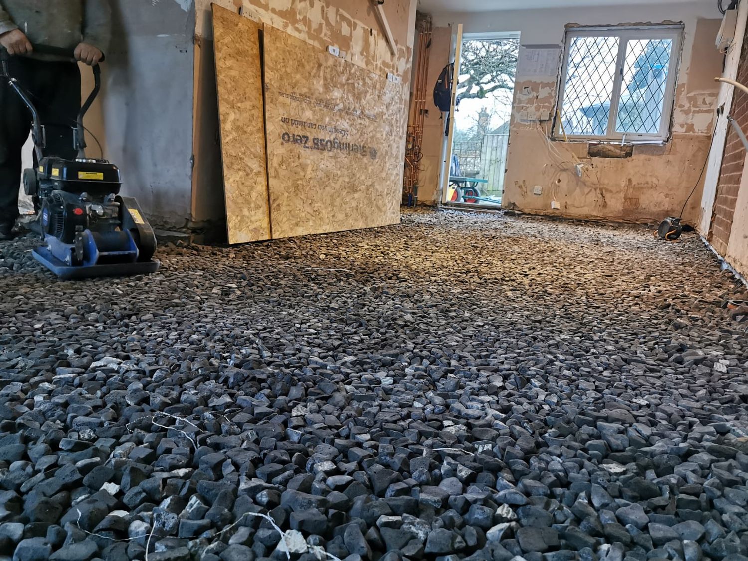 Geocell recycled foam glass insulation being compacted in Listed building in Penn, Buckinghamshire