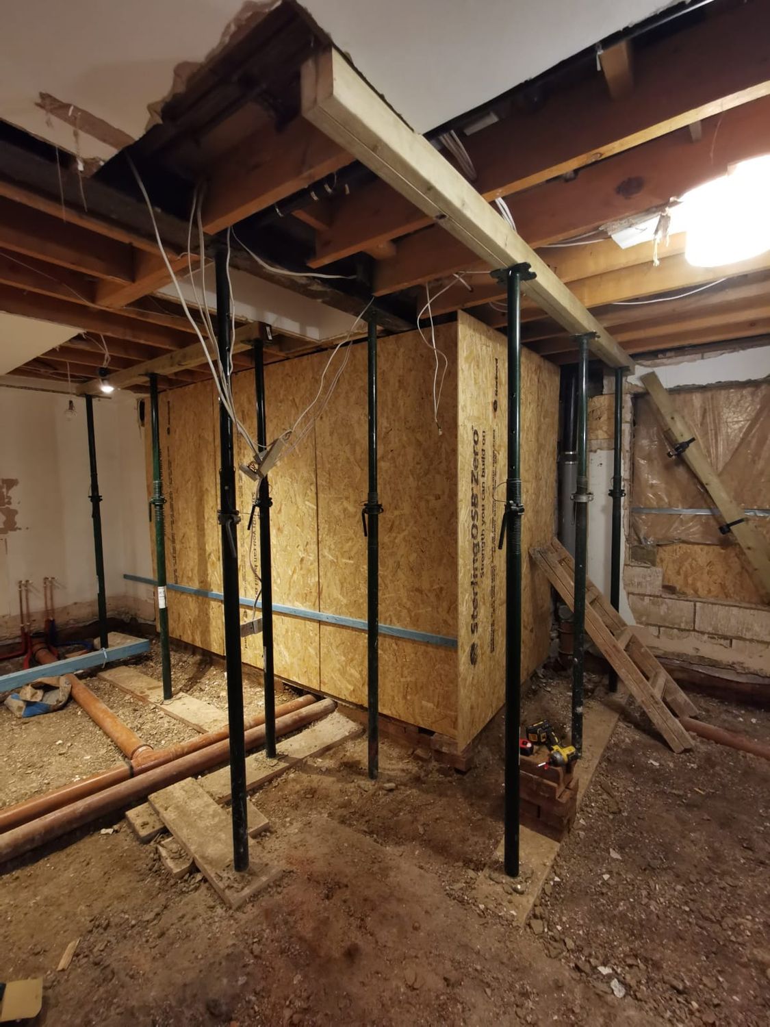 Temporary ceiling support in place for new structural beams