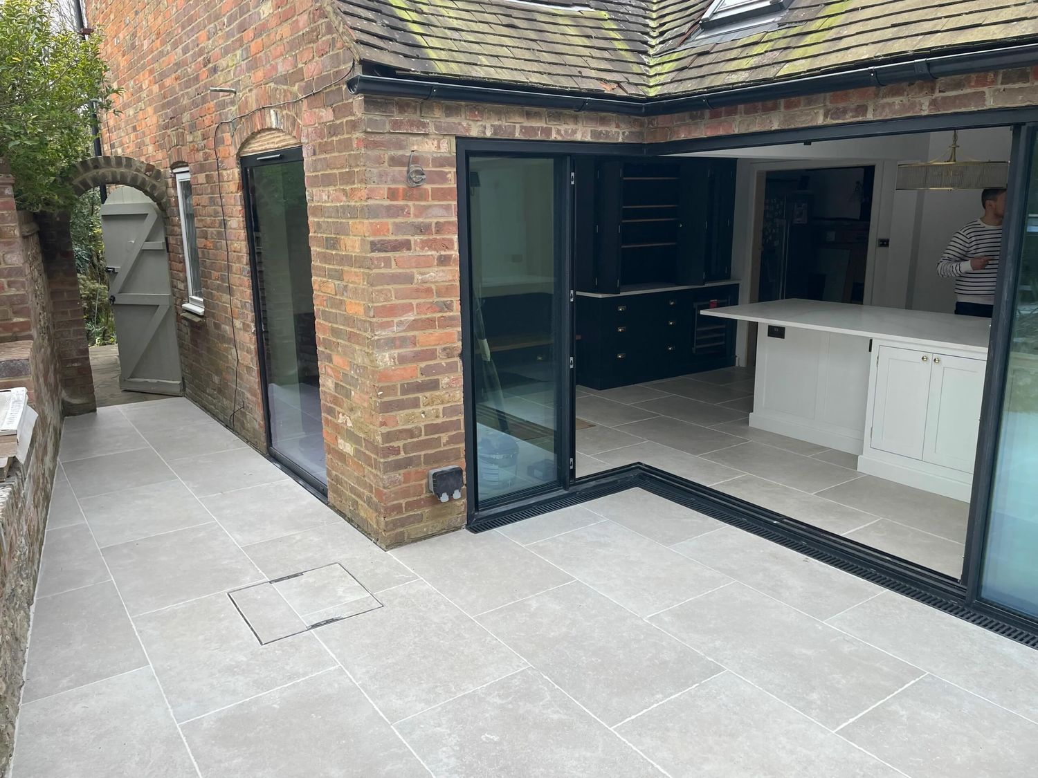 Listed cottage refurbishment completed, with rear opening and paving