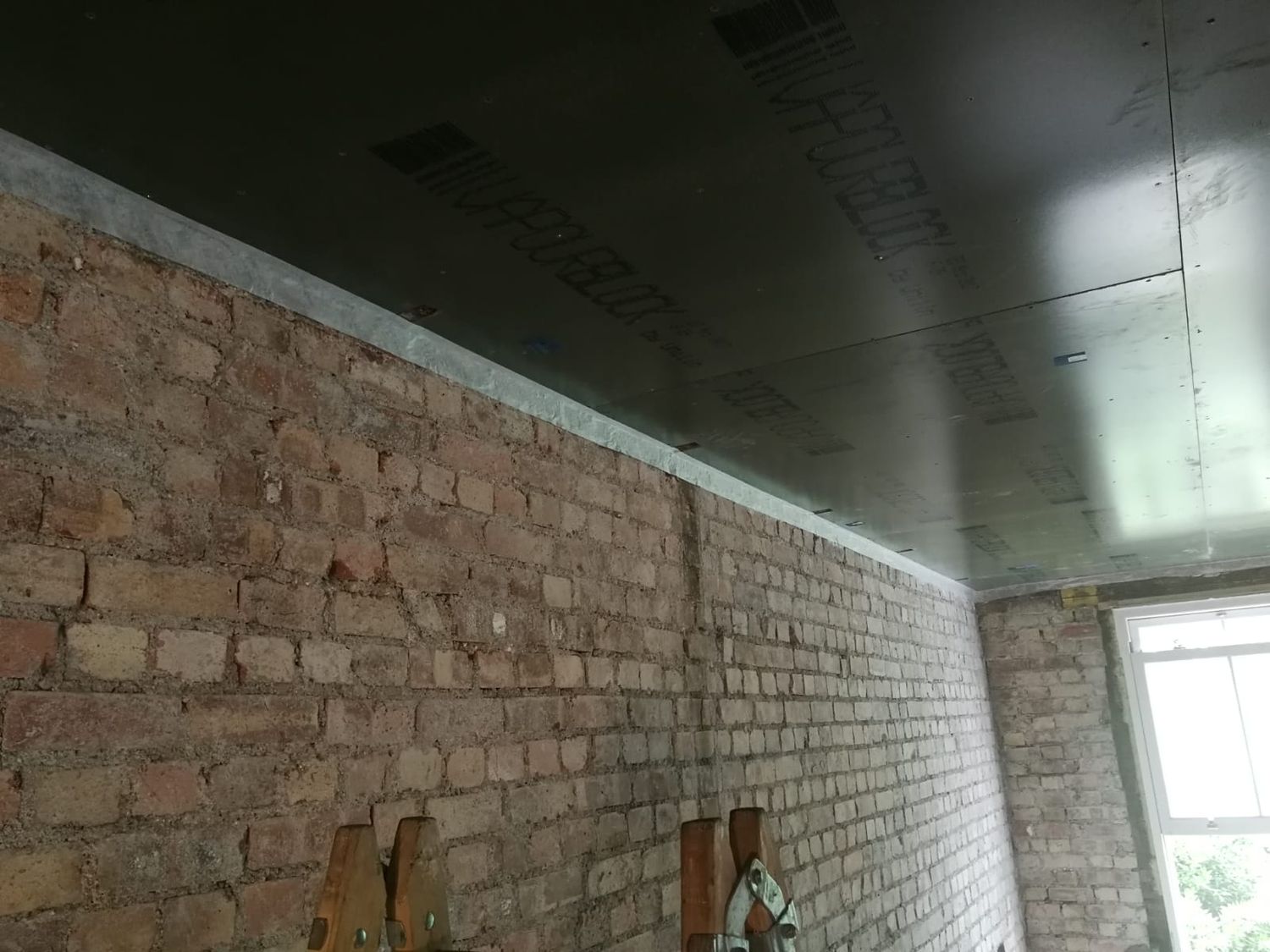 Finsa SuperPan Airtight vapour barrier boards taped around with ProClima airtightness tape