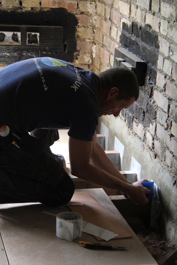 Airtightness taping around floor joists at wall-floor junctions