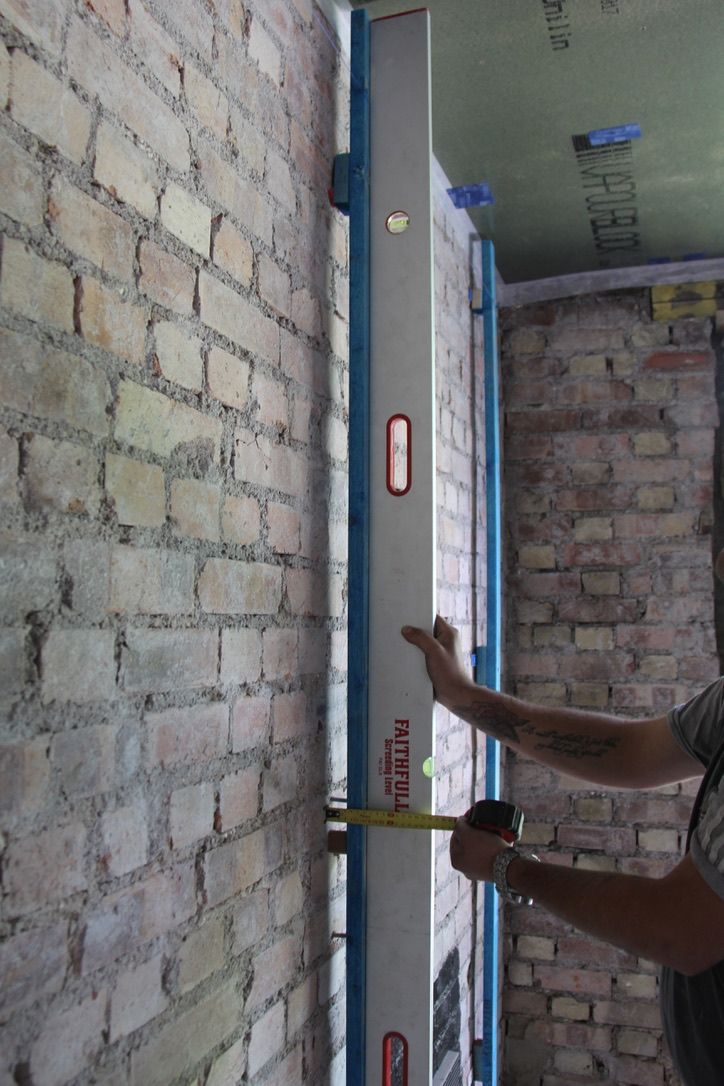 Battens are being installed in preparation for internal wall insulation