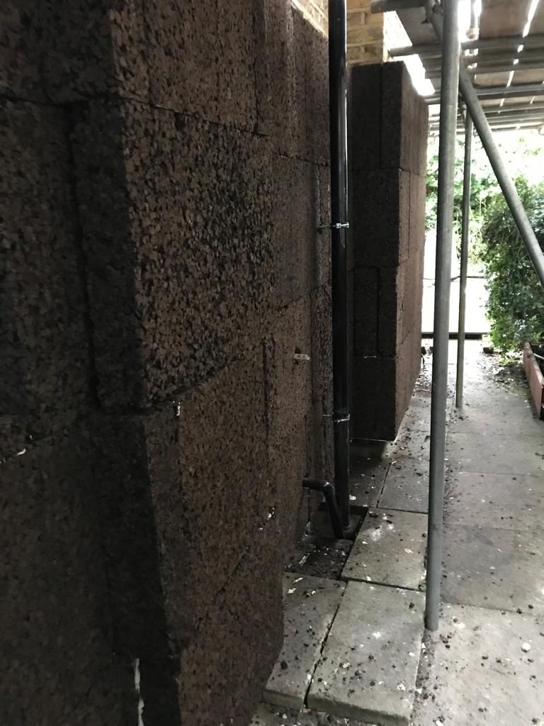 Installation of cork boards onto side wall
