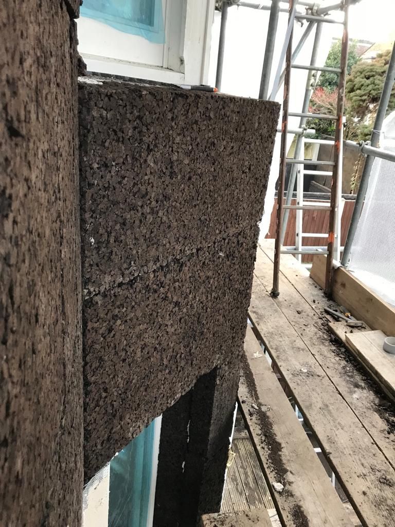 Cork boards fitted around bay window