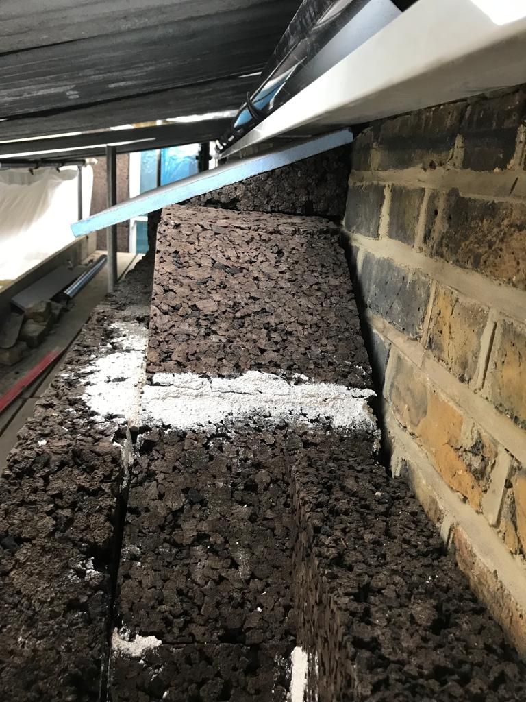 Insulation being detailed to lead rainwater away