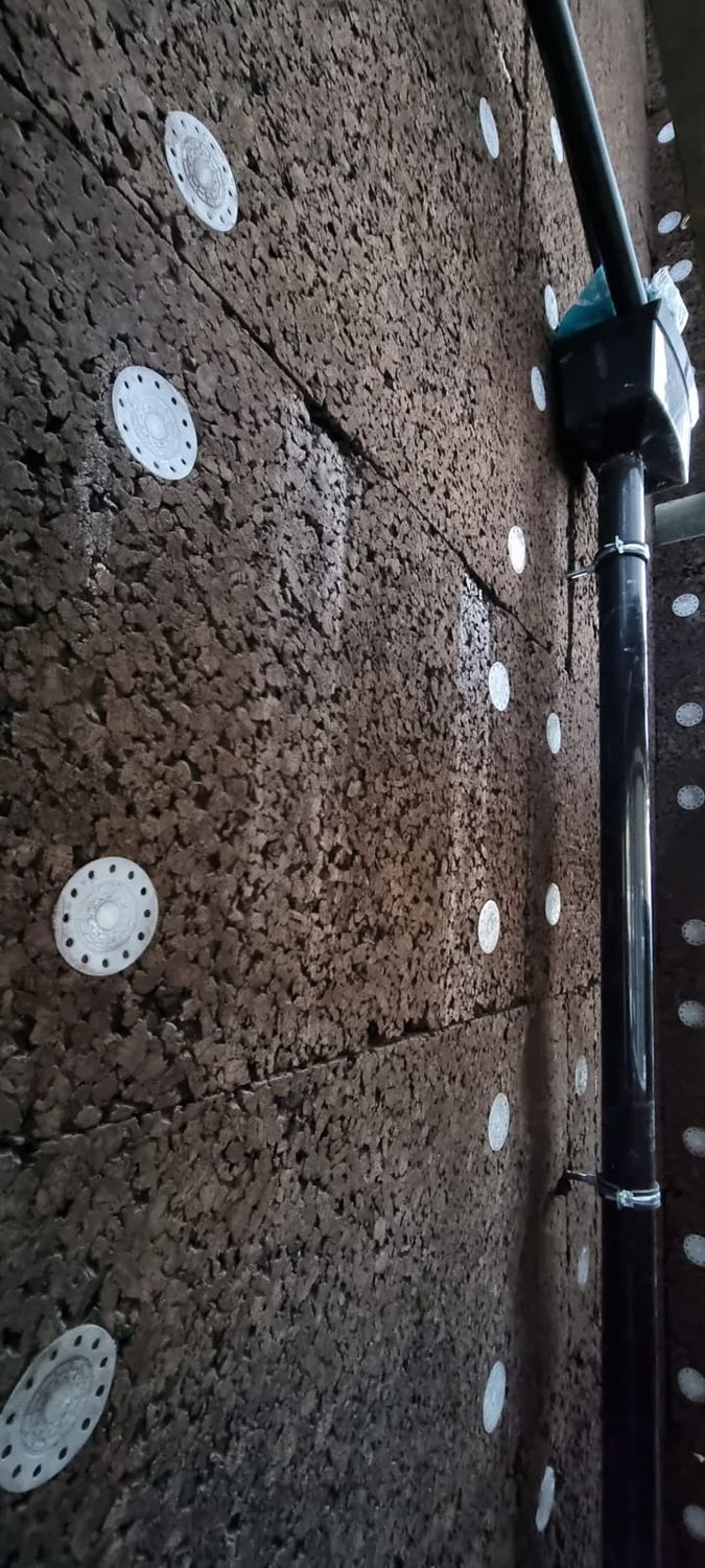 Downpipes refitted after installation of cork insulation boards