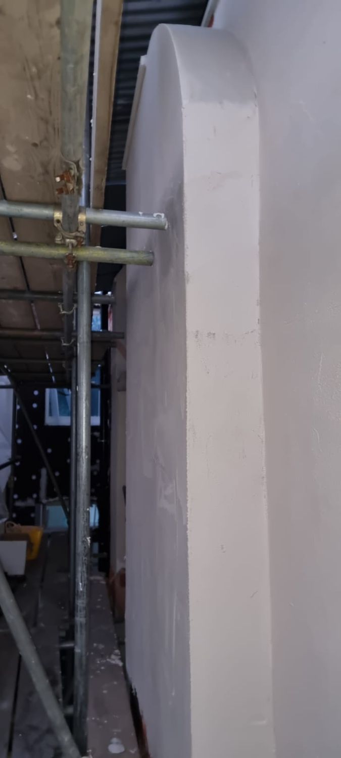 Application of Baumit MC 55 lime base coat onto cork insulation boards