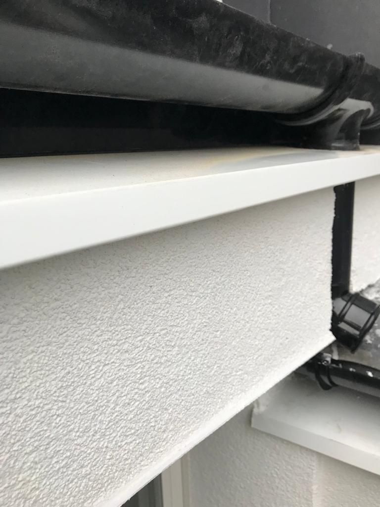 White powdered aluminium verge trim installed to cap off insulation