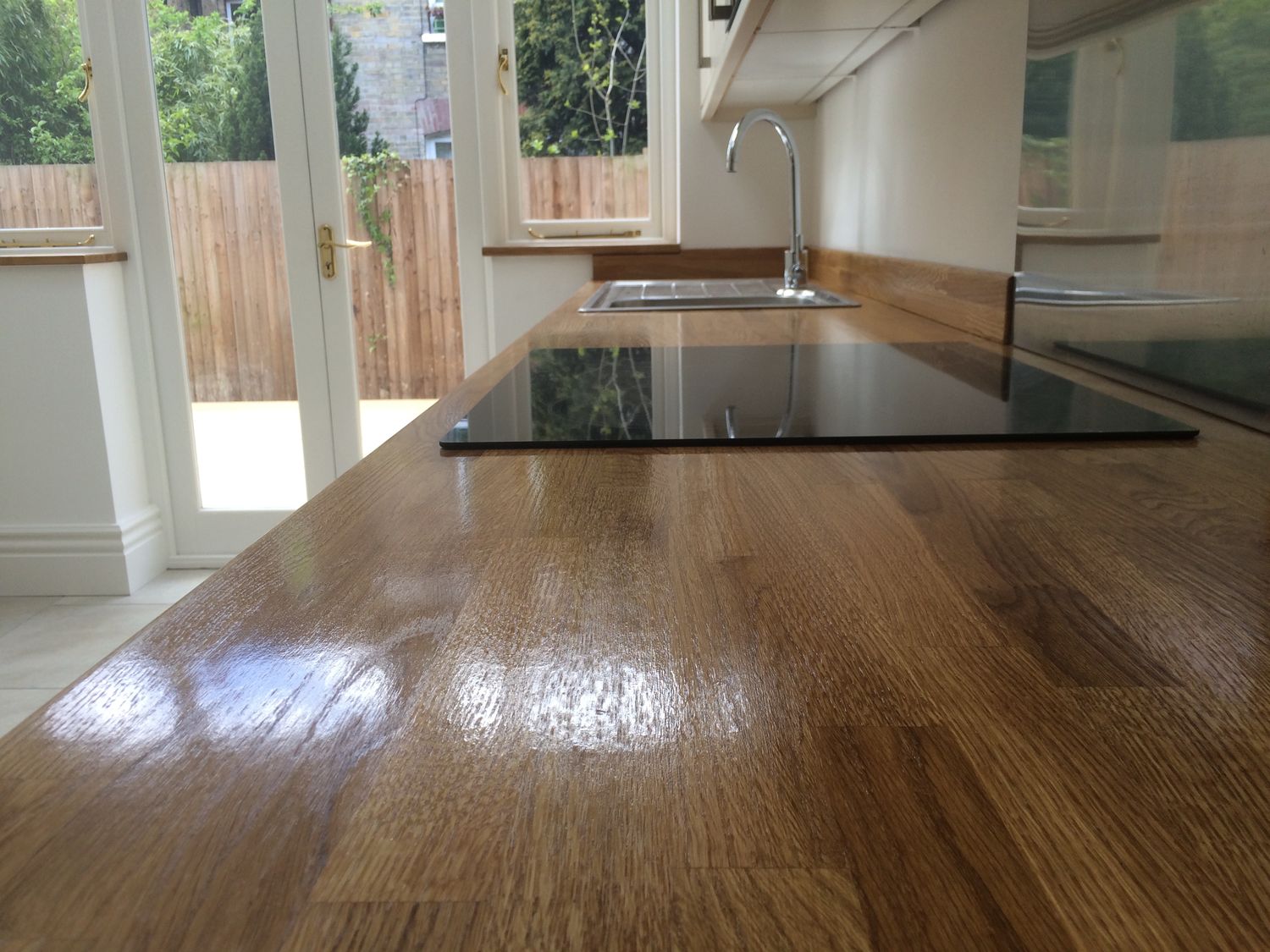 Kitchen installed, with oiled wooden worktop