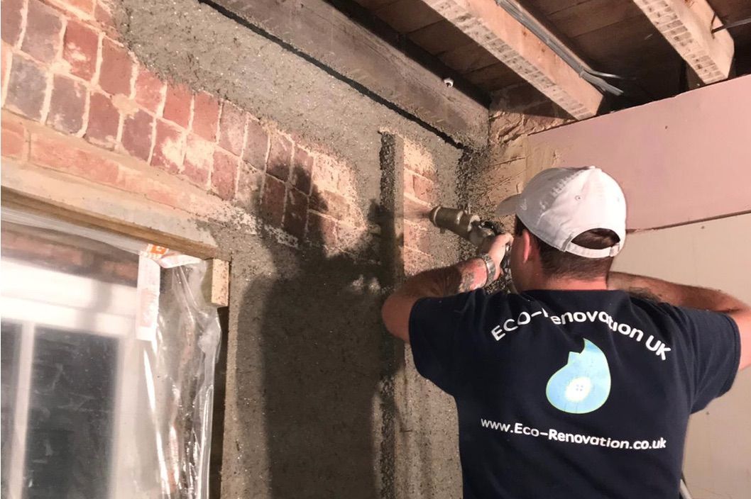 Diathonite Evolution lime-cork-clay insulating render being sprayed to walls