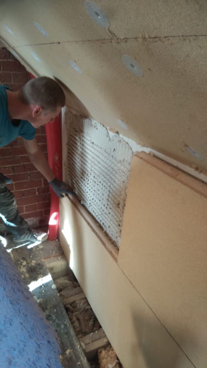 Pavatex wood fibre internal wall insulation board fitted with lime based adhesive