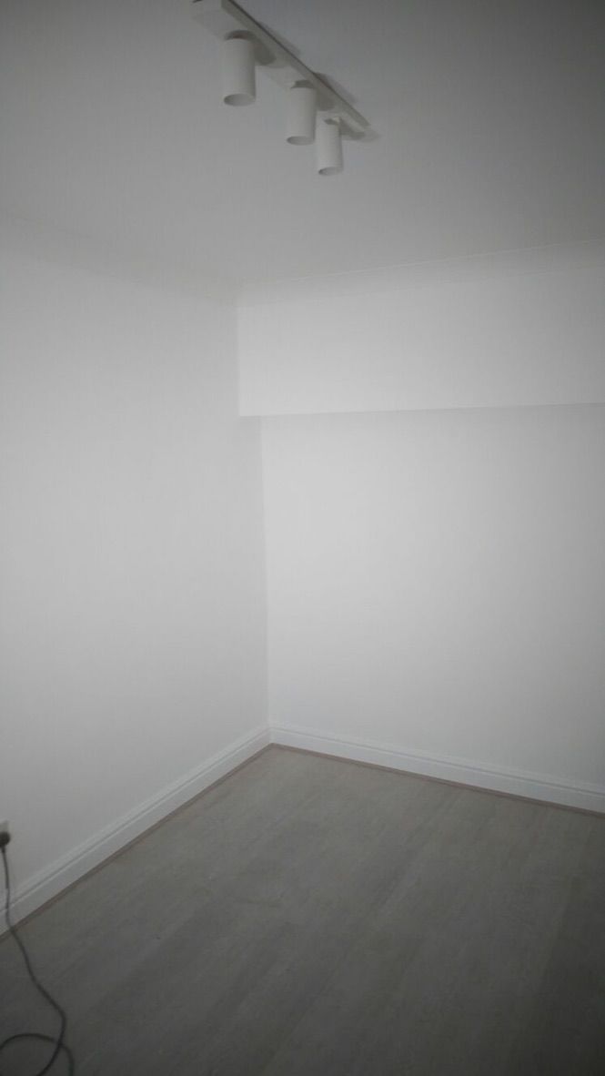 Insulated, lime plastered, painted walls in converted garage room