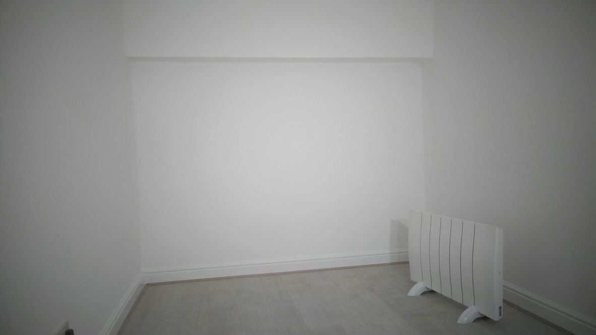 Insulated, lime plastered, painted walls in converted garage room