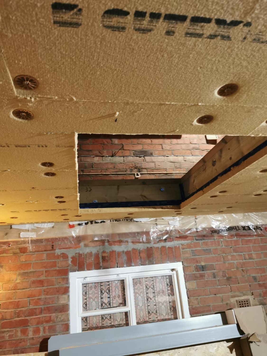 Gutex wood fibre insulation boards fixed under rafters