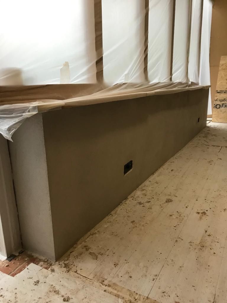 Lime plaster insulated masonry wall