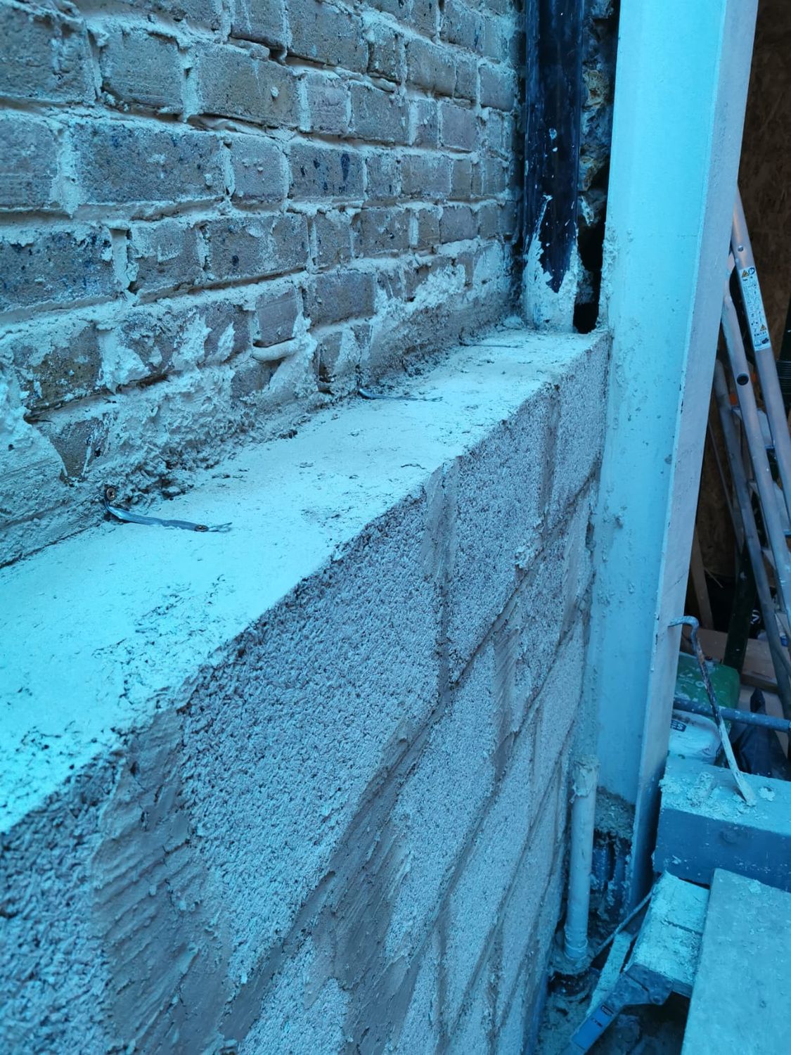 Hempcrete blocks internal wall insulation installed onto masonry wall