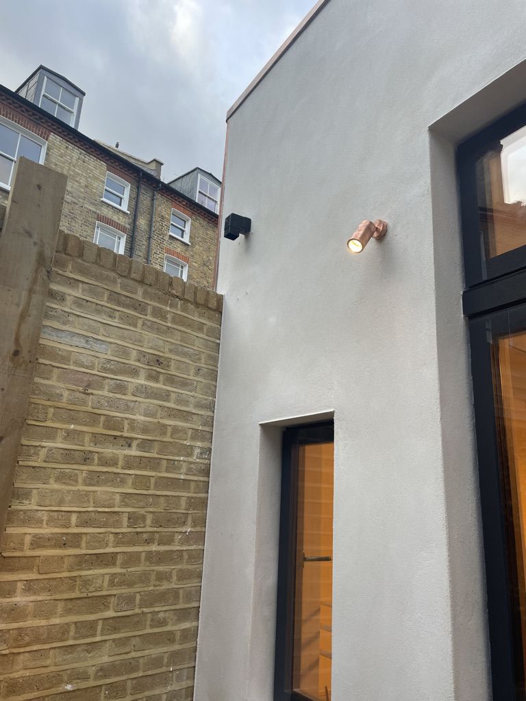 External light on rear elevation and terrace rainwater pipe