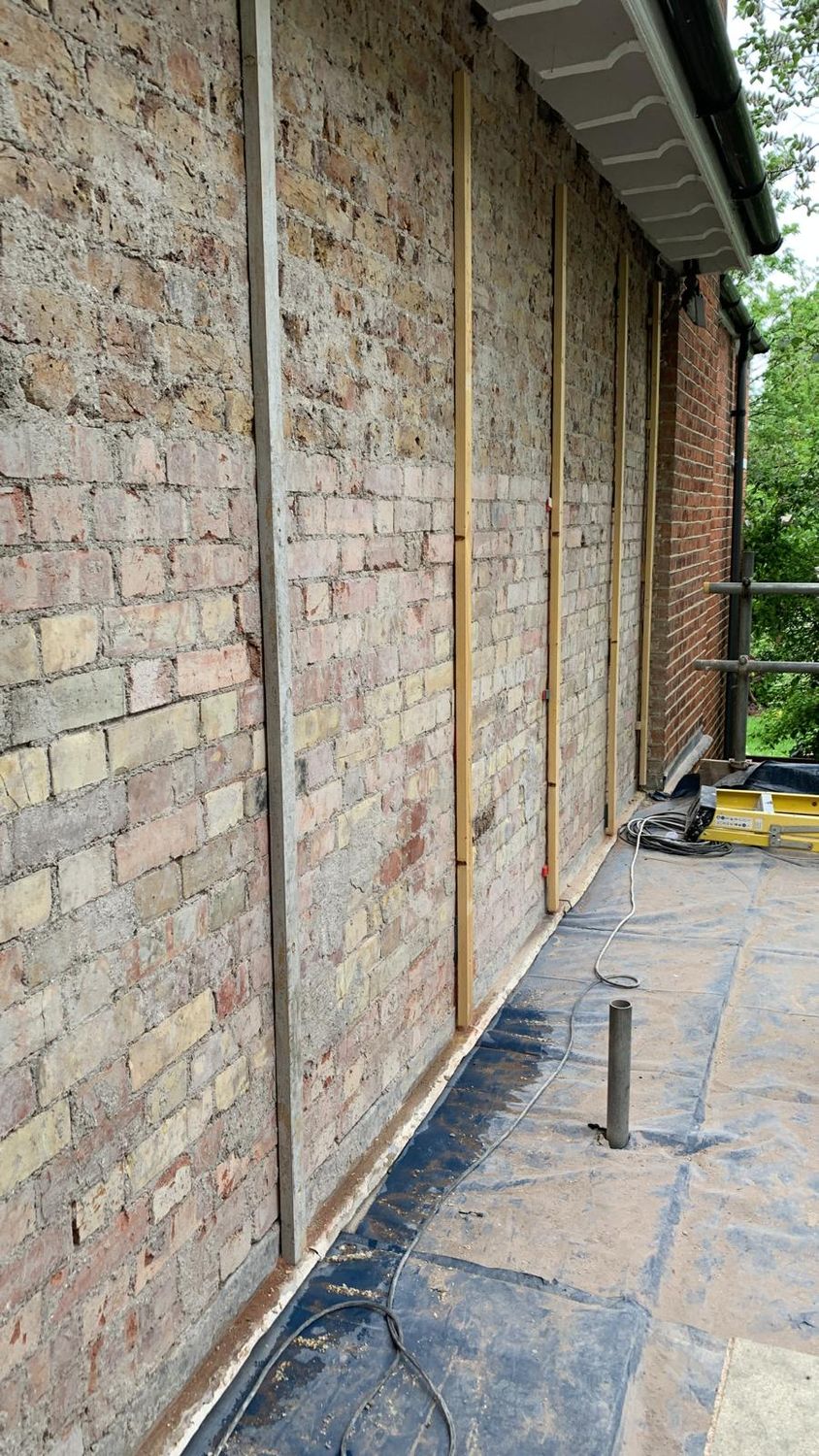 Preparation works - installing battens to set level for lime render