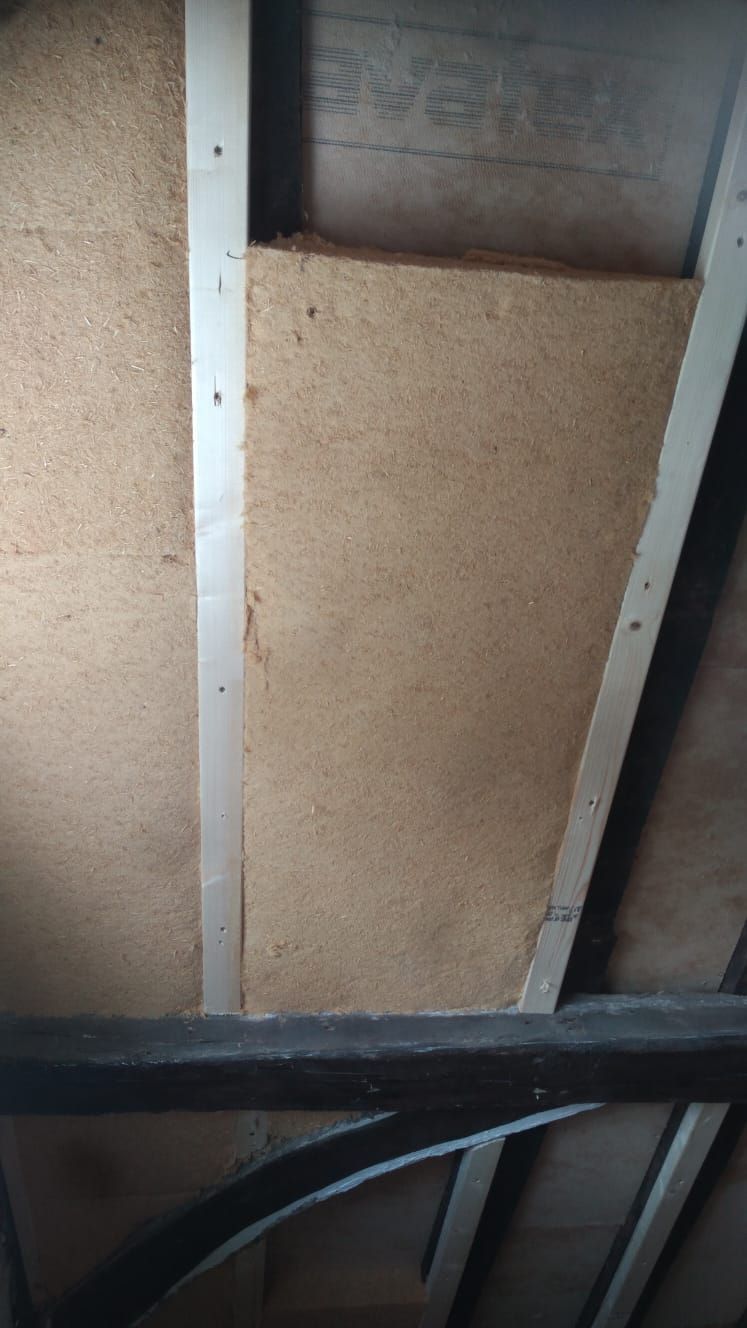 Pavatex flex insulation goes behind exposed beams